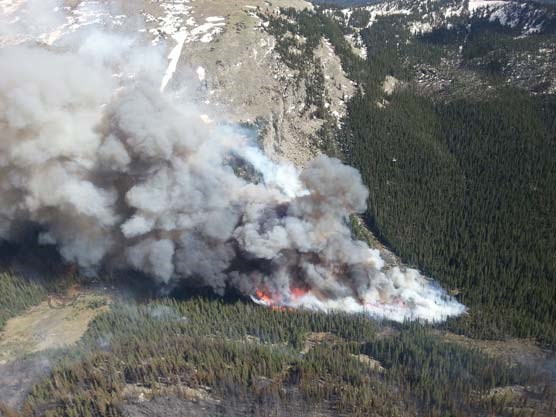 Photo of firefighters using an existing avalanche chute as a natural barrier to perform a burn out operation on June 14, 2013. Photo of firefighters using an existing avalanche chute as a natural barrier to perform a burn out operation on June 14, 2013.