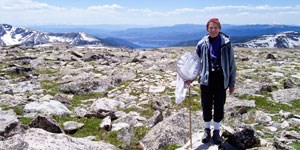 Volunteer Jan Kilgore surveying on Flattop mountain