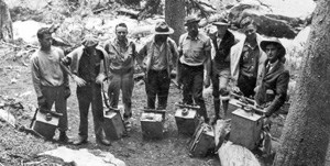 Rangers carrying fish to Loch Vale in the early 20th century