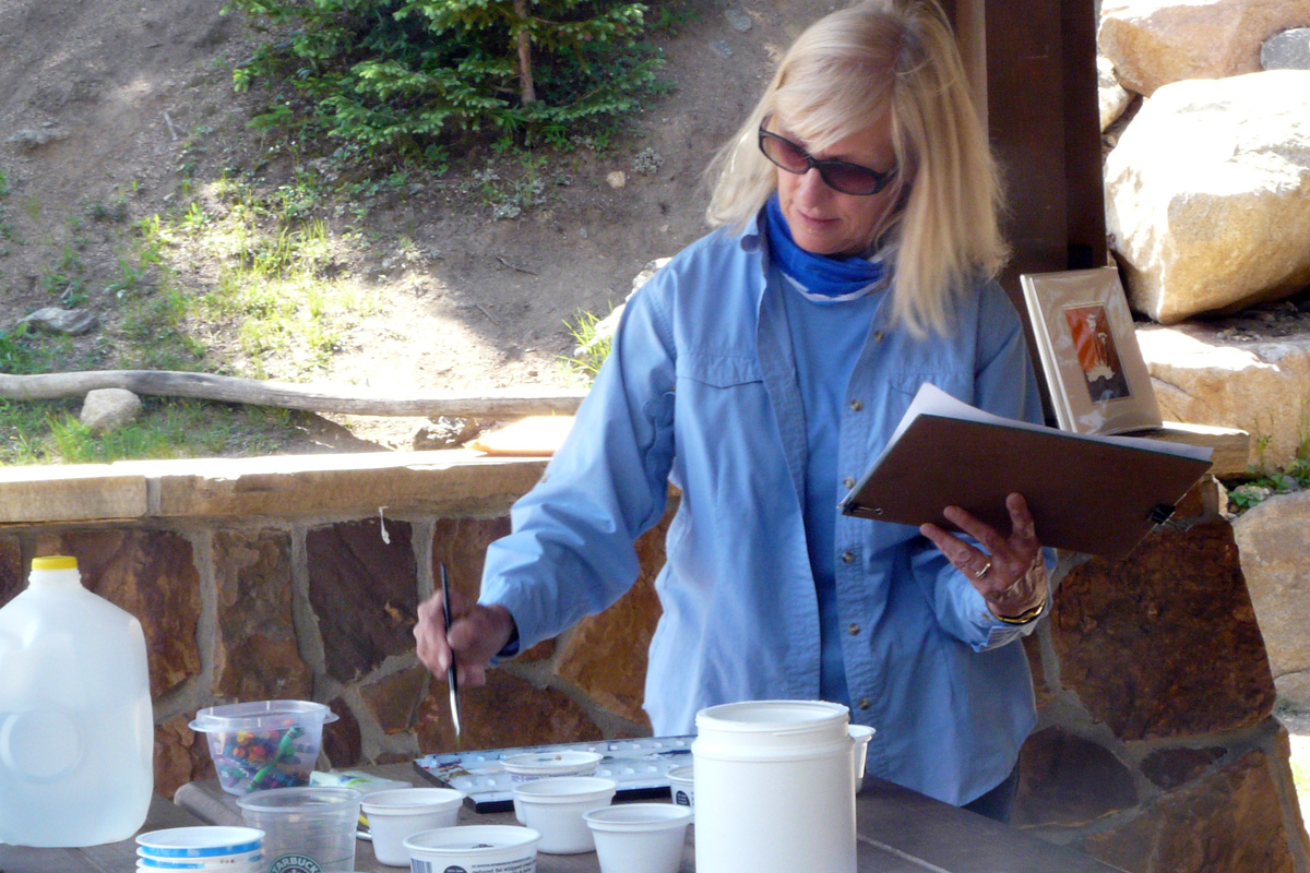 Joy Keown, former RMNP Artist-In-Residence, pictured while painting