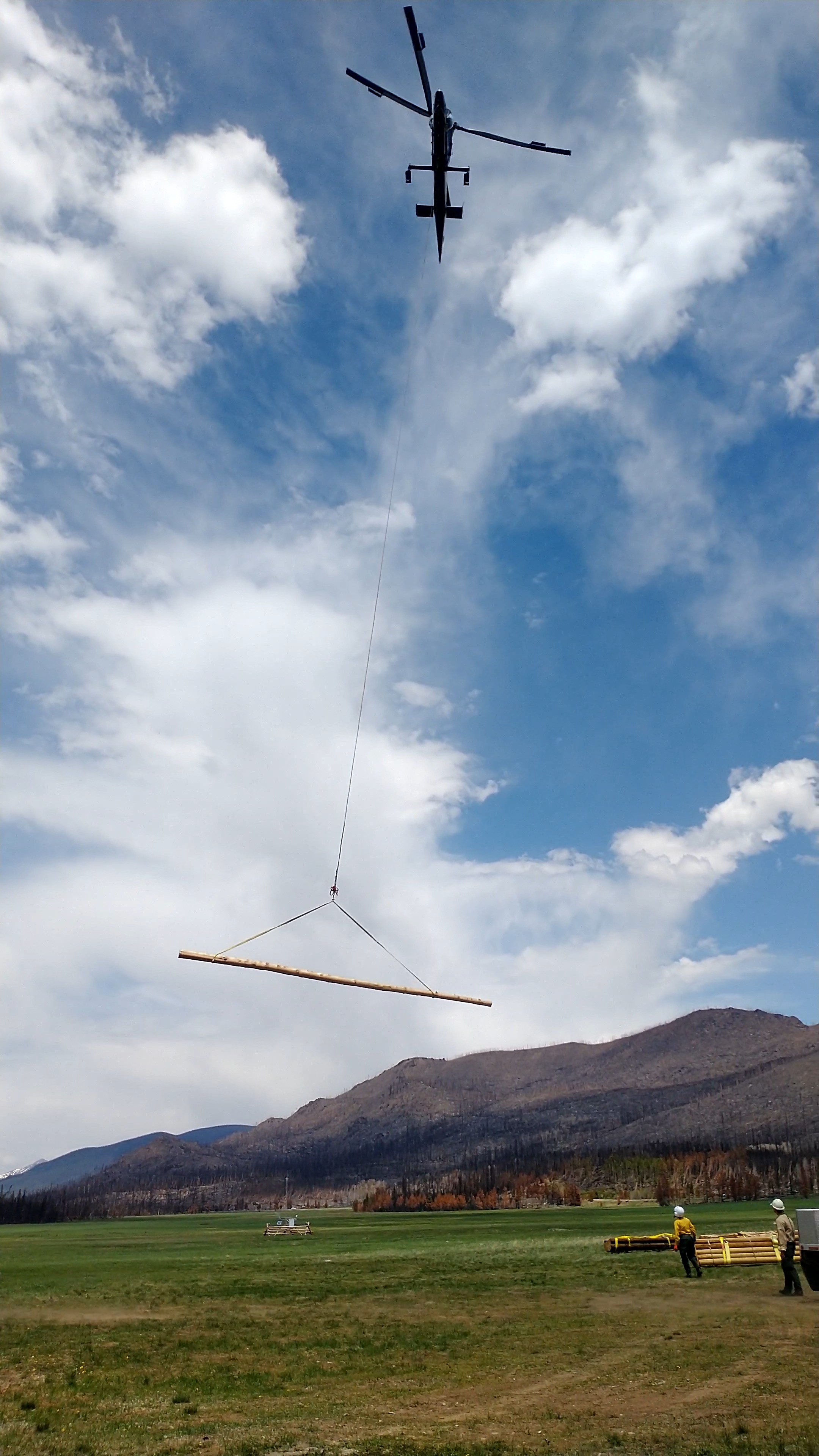 Footbridge materials being flown from helibase on west side of Rocky Mountain National Park June 7 2021