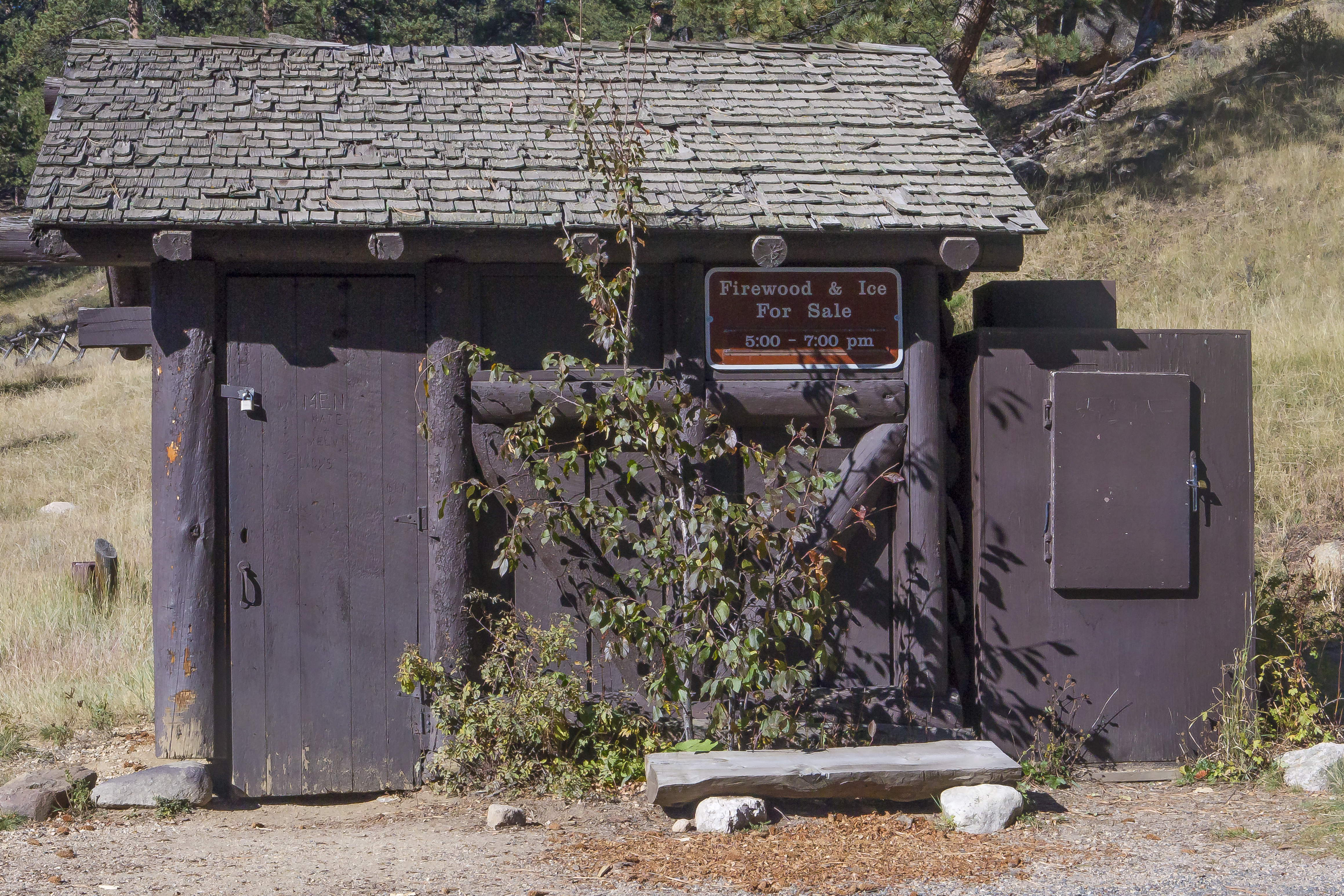 A wooden shed in Aspenglen Campground is where firewood is stored and sales take place.