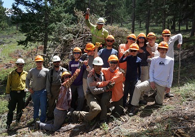 Volunteer group photo in the field Volunteer group photo in the field
