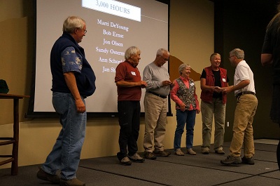 Superintendent Vaughn Baker and Chief of Interpretation and Education Rich Fedorchak congratulate volunteers who have served 3,000 hours at Rocky. Superintendent Vaughn Baker and Chief of Interpretation and Education Rich Fedorchak congratulate volunteers who have served 3,000 hours at Rocky.