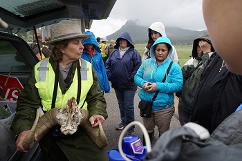 Park Ranger Marilyn Irwin at Sheep Lakes educates the group about the importance of the lake to the bighorn sheep. Park Ranger Marilyn Irwin at Sheep Lakes educates the group about the importance of the lake to the bighorn sheep.