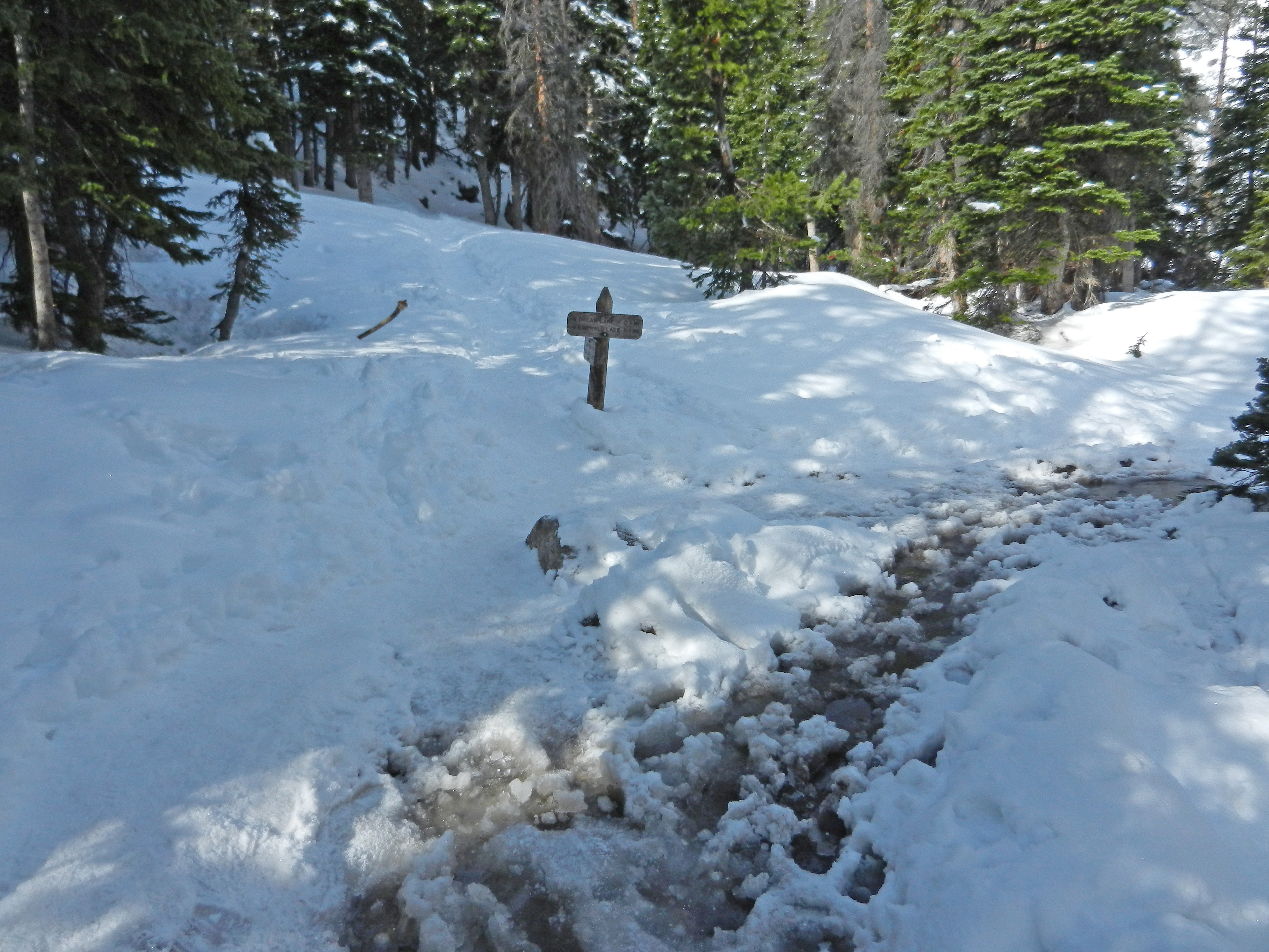 The ground is covered with snow and ice at the Dream - Haiyaha Junction