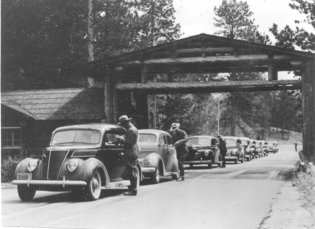 Fall River Entrance_Rangers talking with visitors arriving in cars, 1940