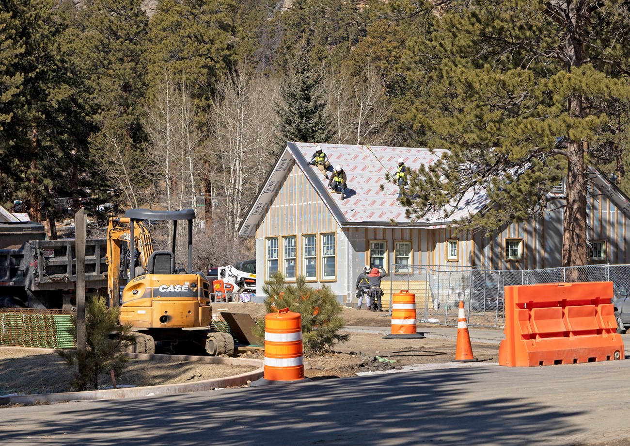 Contractors are working on the roof of the Fall River Entrance office building