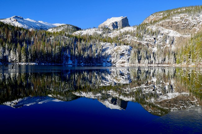 Bear Lake in winter with a reflection of Hallett Peak Bear Lake in winter with a reflection of Hallett Peak