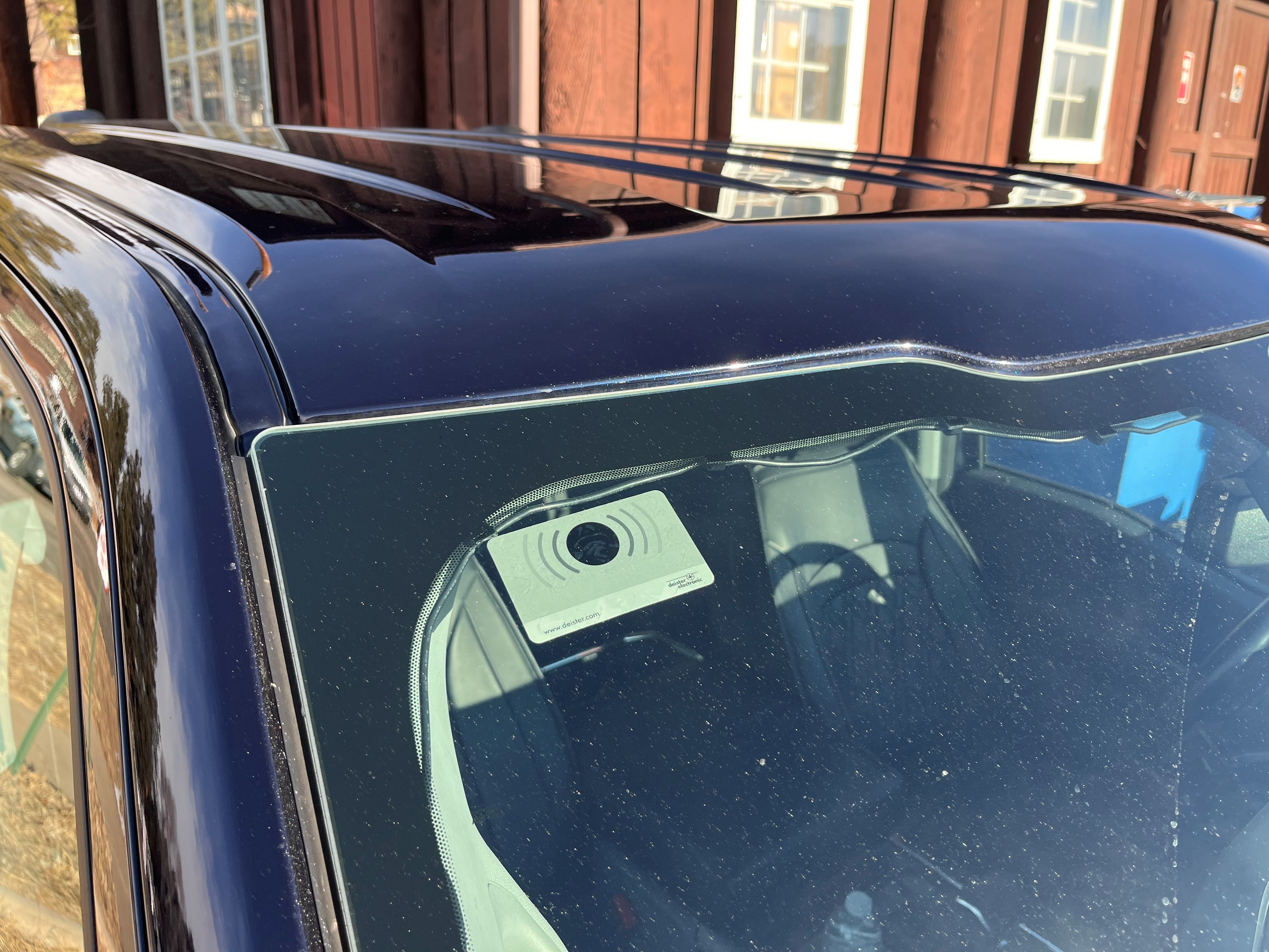 A transponder has been correctly placed on the upper passenger side of a vehicle's window