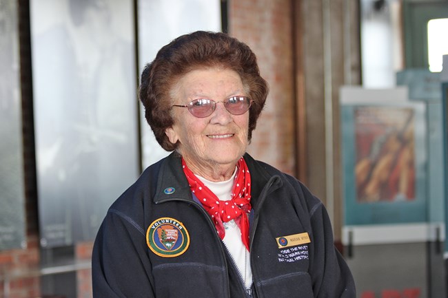 Senior caucasian female smiles at the camera.