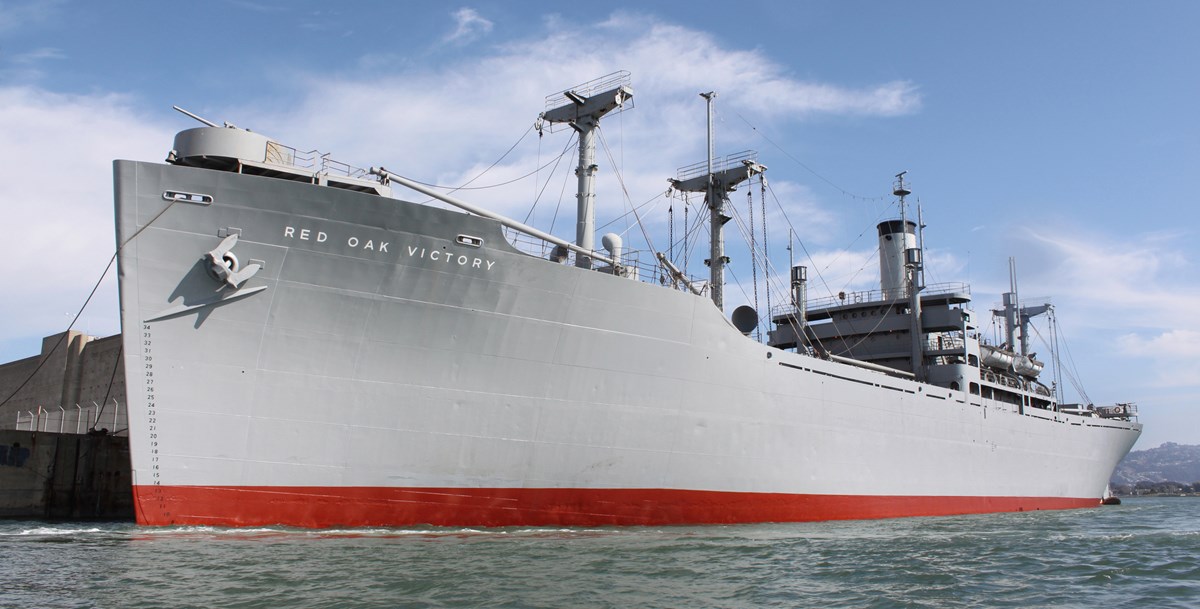 SS Red Oak Victory Ship sits next to the dock. SS Red Oak Victory Ship sits next to the dock.