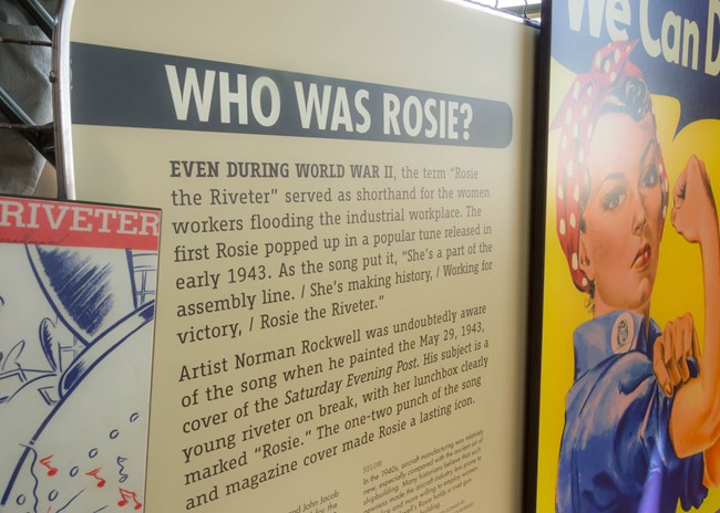 Photograph of an exhibit sign that says "Who Was Rosie" .