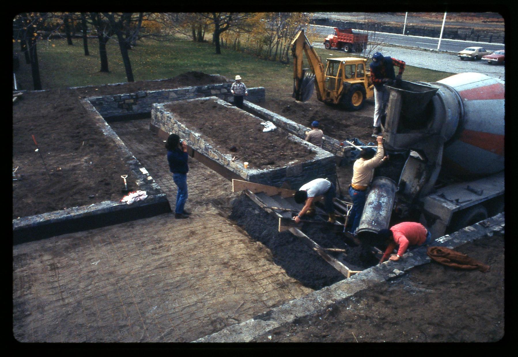 Construction of walkway and stone steps with concrete truck
