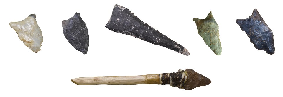 Various styles of Paleoindian stone points and an example spear foreshaft