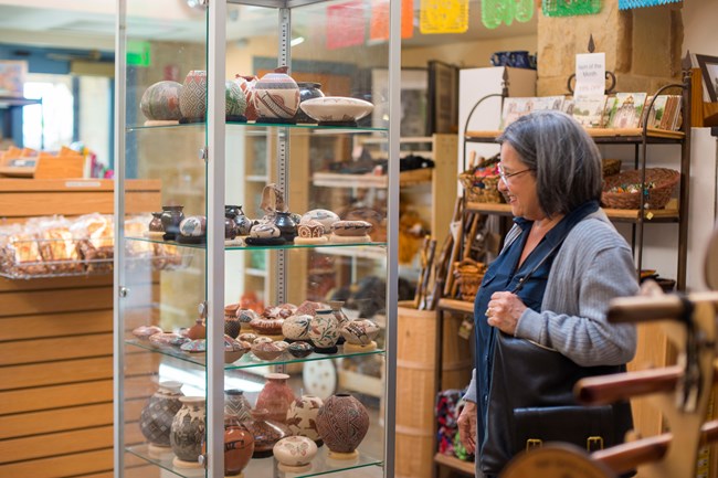 Woman shops in the gift shop managed by WNPA