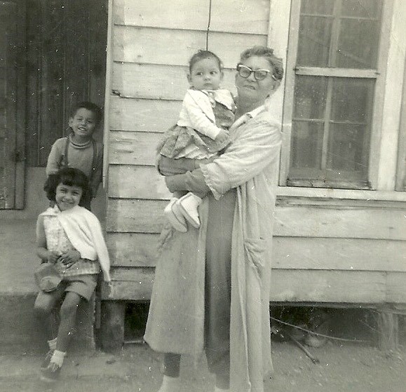 Grandmother holding baby in 1962