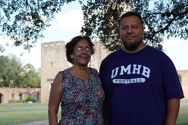Mother and Son standing in front of Mission San Jose