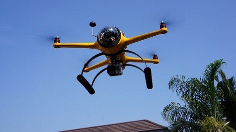 Drone flying over building