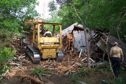 Contractors removing old house