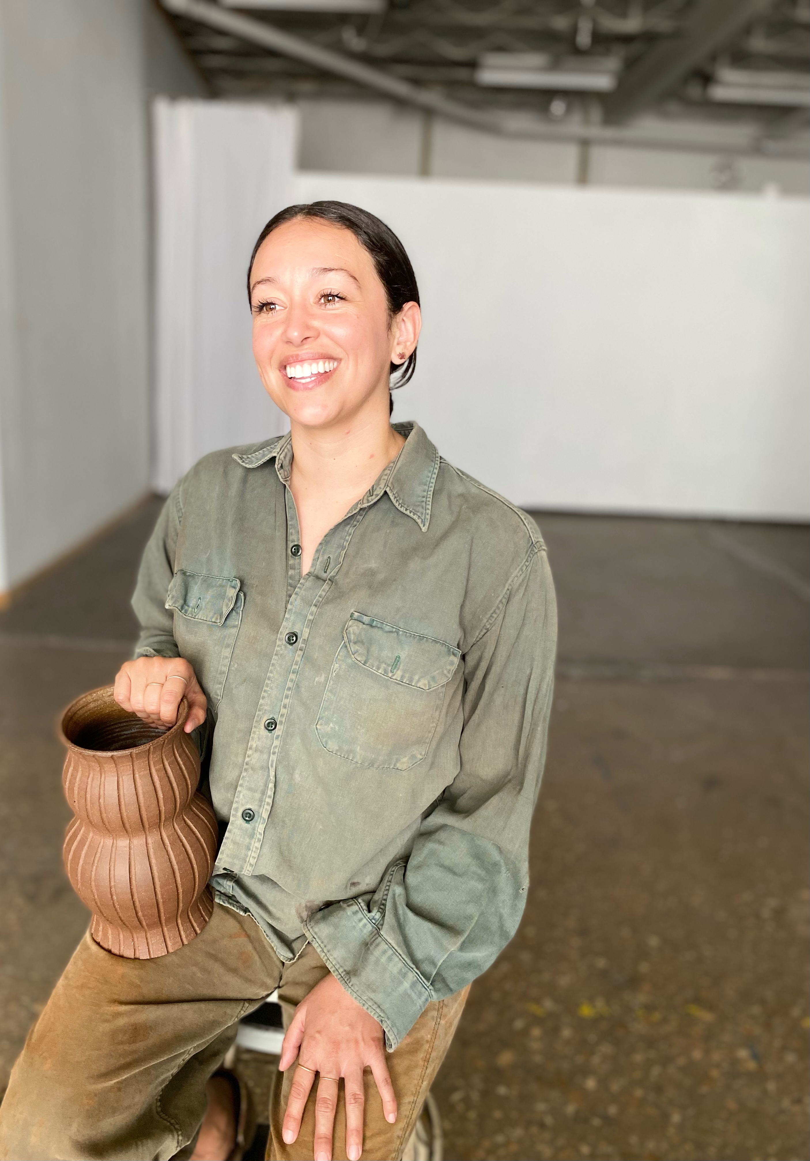 Michelle Hernandez image of female holding a clay pot