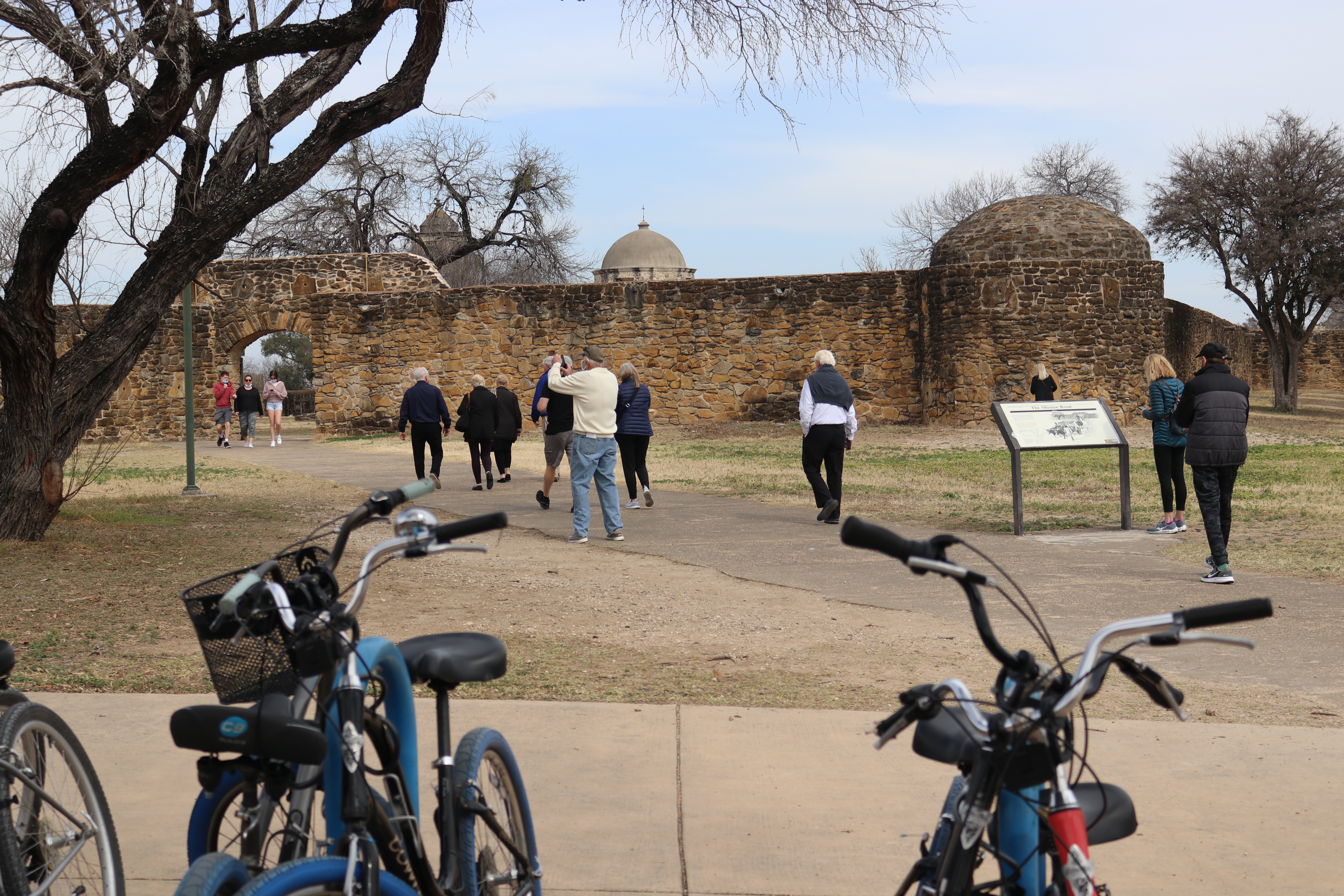 Park Visitors Walking Into Mission