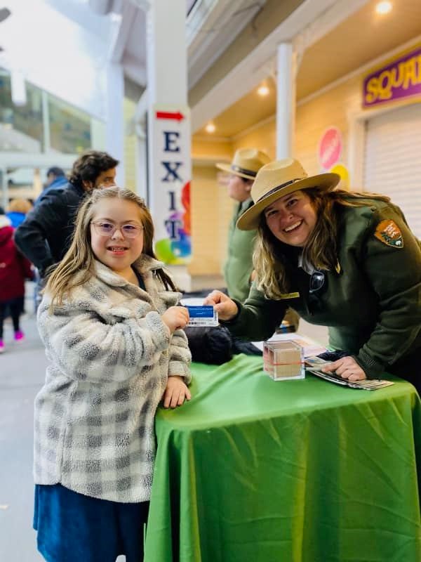 Ranger giving girl an Access Pass