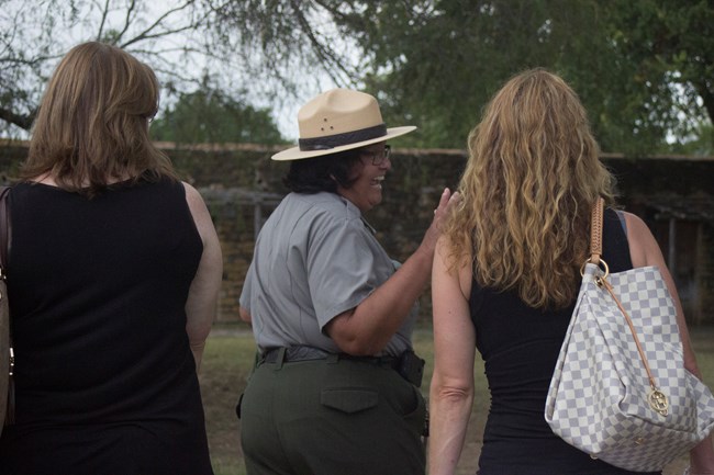 Anna Tour Park Ranger laughs with visitors during tour