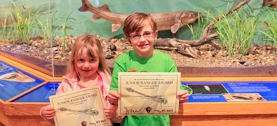 Children show their junior ranger certificates. Children show their junior ranger certificates.