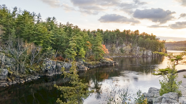 EveningLight Evening light falls on a cliff and river.