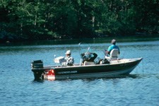 three fishermen in small boat