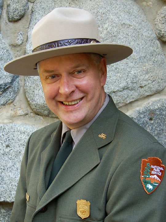 man in green uniform wearing ranger hat