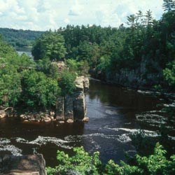 A wooded Cliff Rock outcropping on a river bend. A wooded Cliff Rock outcropping on a river bend.