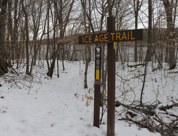 A sign denoting the Ice Age Trail is seen, with the St. Croix River in the background. (NPS photo)