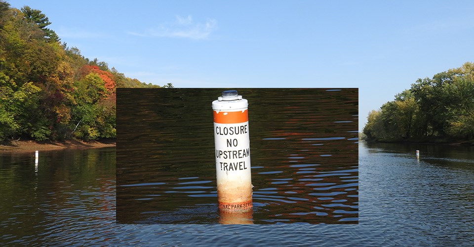 A rectangular picture of a white river buoy with two orange bands overlayed on an image of a river with green trees on its shore. Blue sky above.