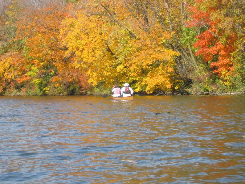Two canoers enjoy the fall colors on the St. Croix. NPS photo. Two canoers enjoy the fall colors on the St. Croix. NPS photo.