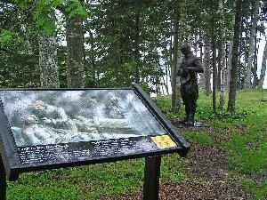 Wayside exhibit and bronze statue