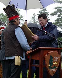 Chief Hugh Akagi presents a letter to the Honorable Xavier Darcos of France.