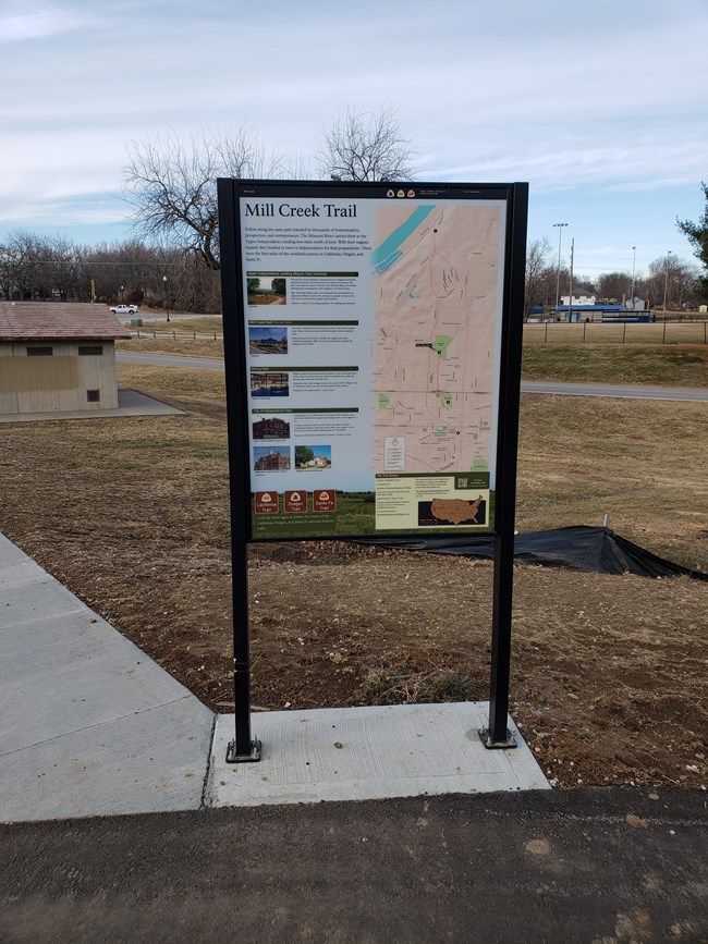 Upright sign in a park.