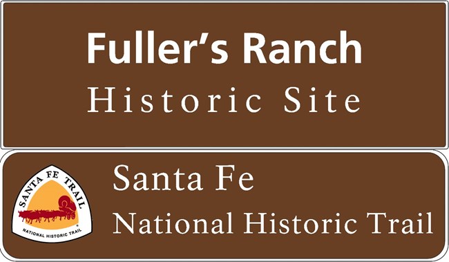 Brown sign, "Fuller's Ranch Historic Site, Santa Fe National Historic Trail," and trail logo.