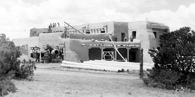 Historic image of CCC men constructing adobe building