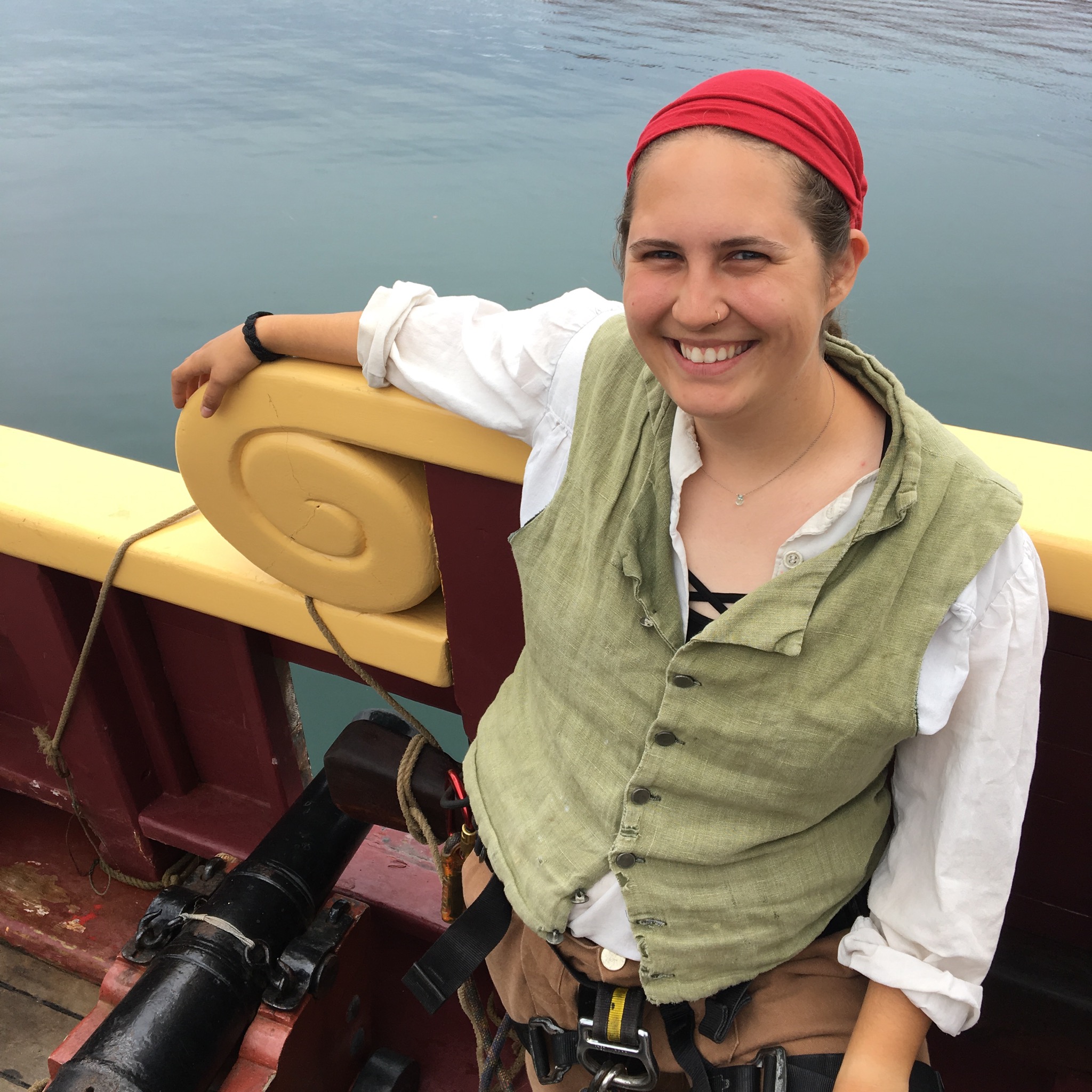 Sara in her Woman at ship's rail with kerchief on head, wearing vest and shirt