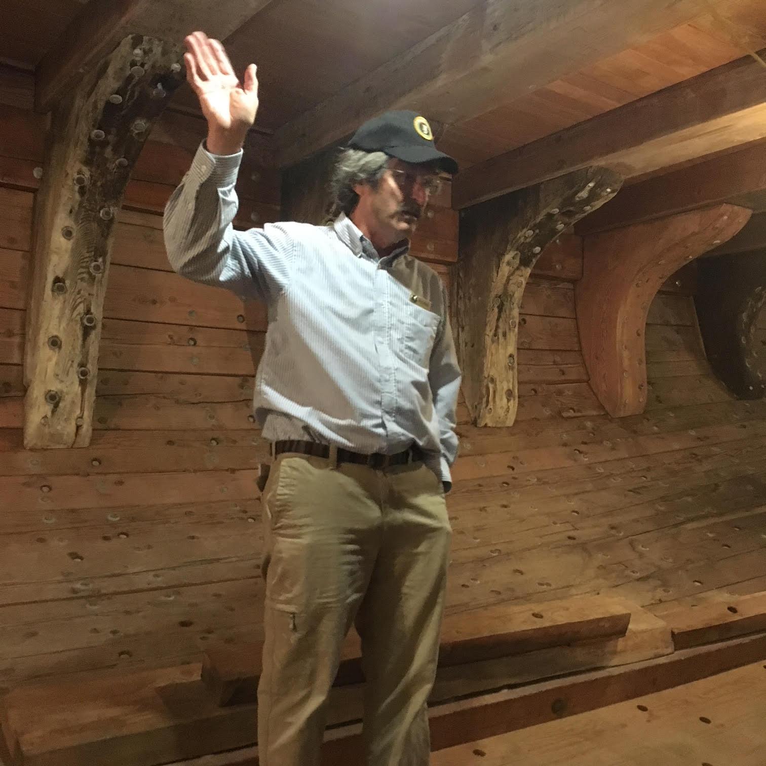 Docent Gregg is pictured in the hold of the C.A. Thayer, an early 19th century coastal lumber schooner berthed at San Francisco Maritime NHP. 