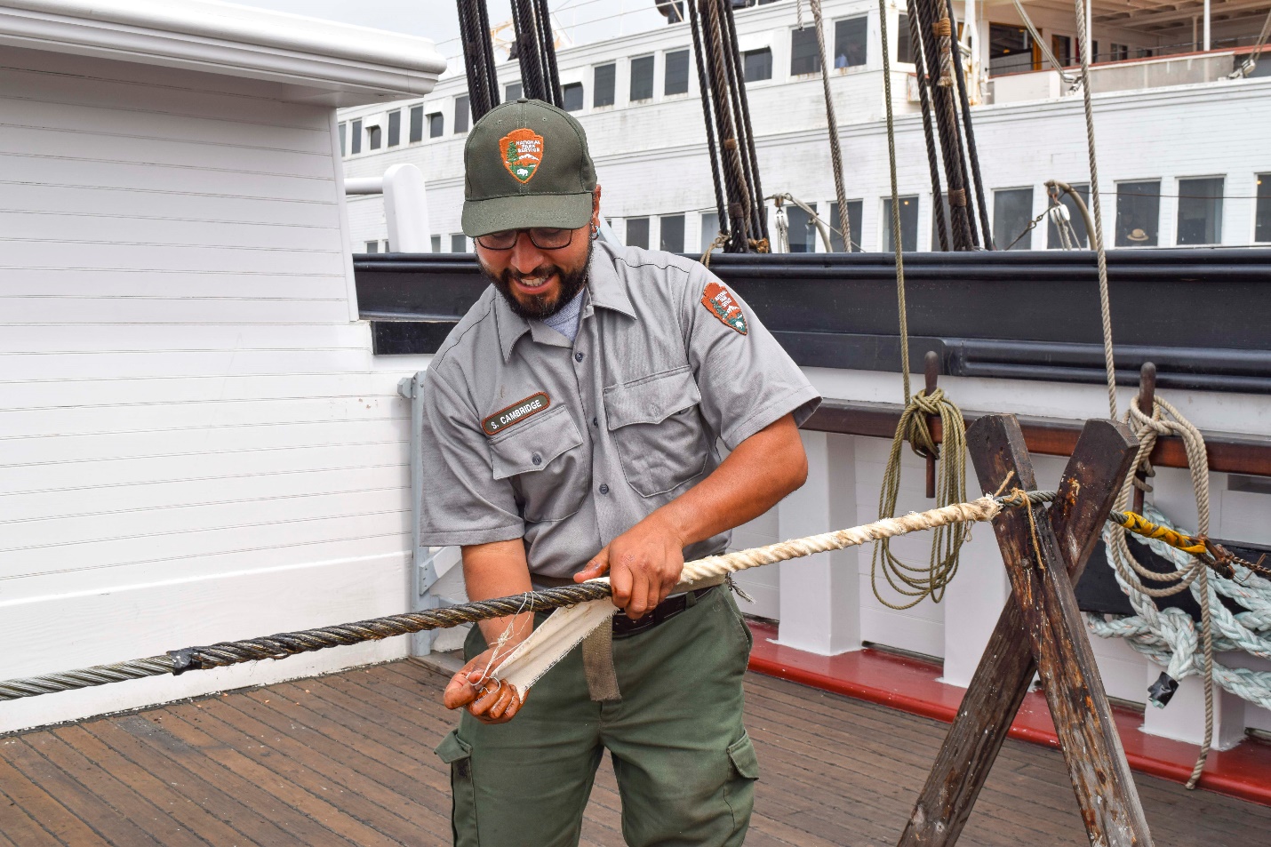 Ships’ rigger Reno Cambridge demonstrates working with standing rigging.