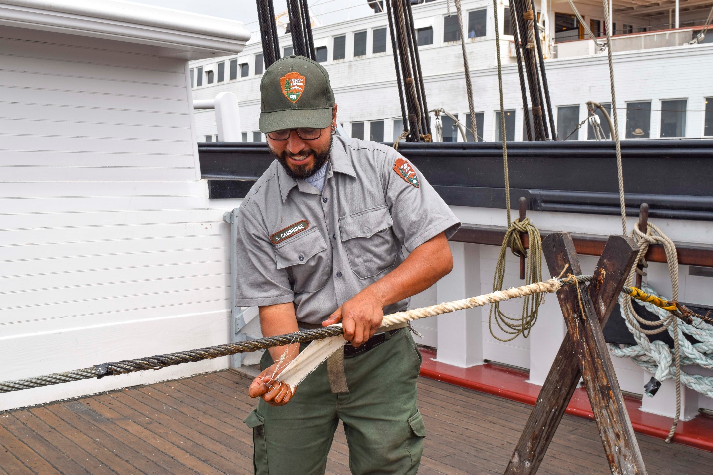 Ships’ rigger Reno Cambridge demonstrates working with standing rigging. Ships’ rigger Reno Cambridge demonstrates working with standing rigging.