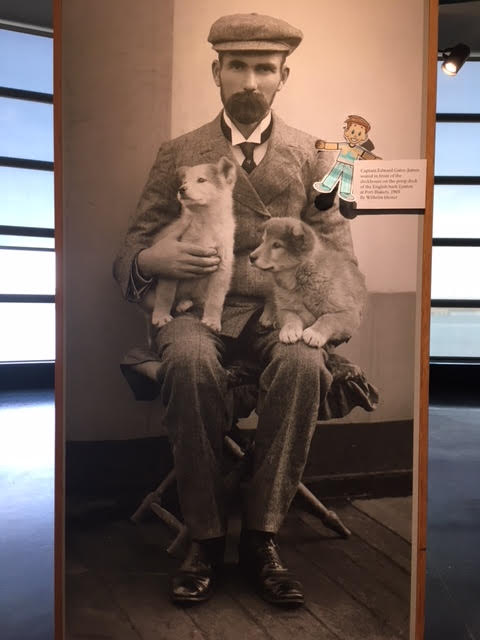 Image of Flat Stanley with Historic Photo of a Ship Captain and his Dogs