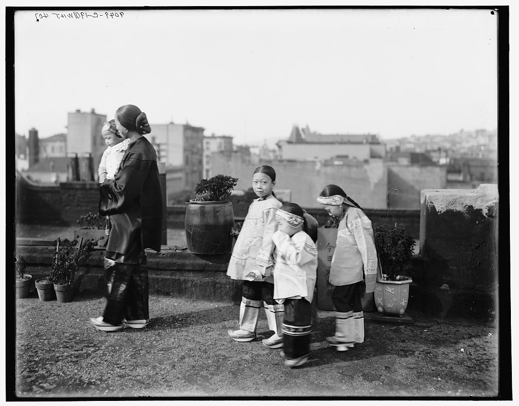 Chinese women and children by William Henry Jackson, c. 1901. Library of Congress A Chinese or Chinese-American woman and three Chinese or Chinese-American girls walk across a city rooftop.
