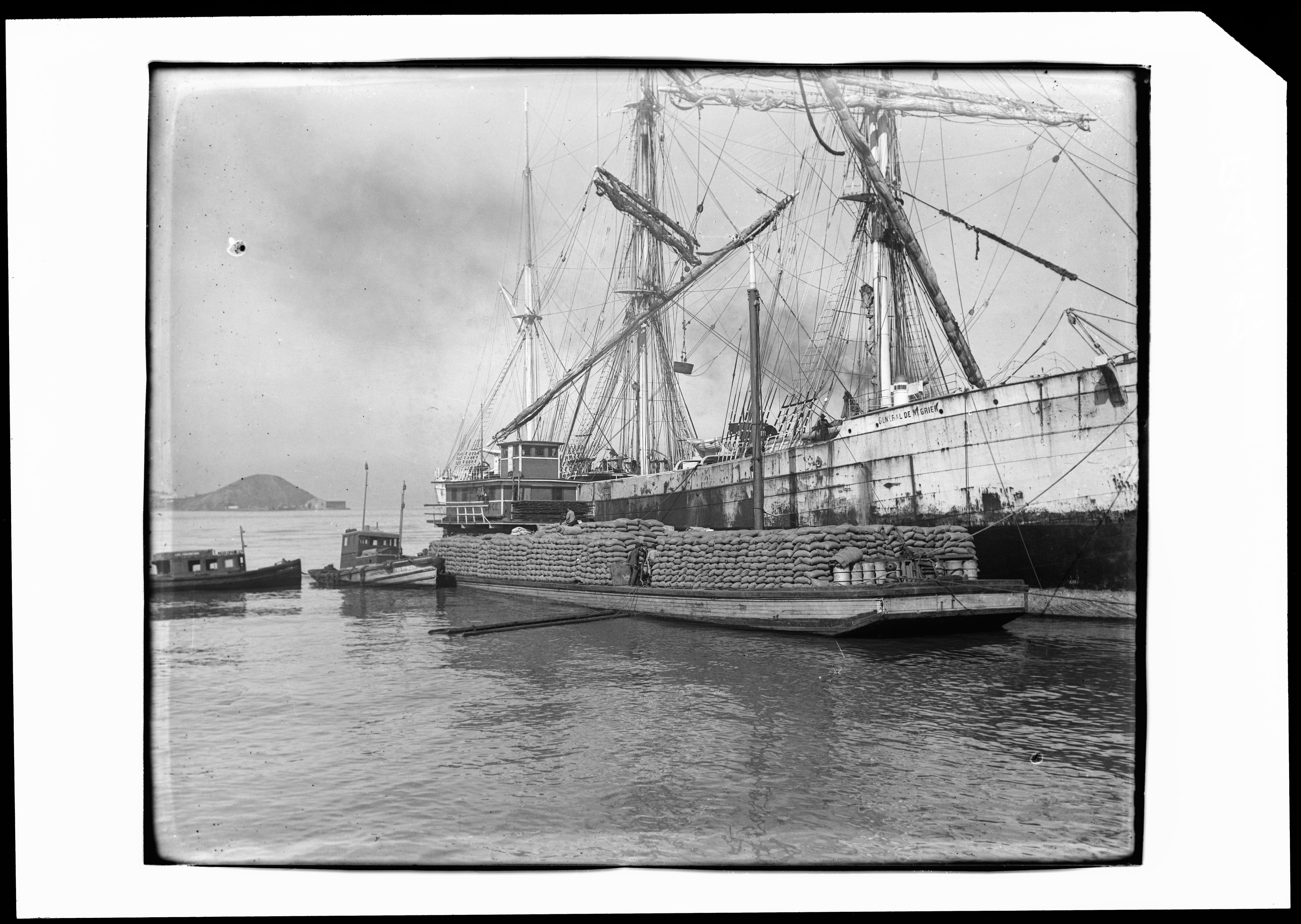General De Negrier (built 1901; bark, 3m), loading grain at the Oakland Long Wharf, undated