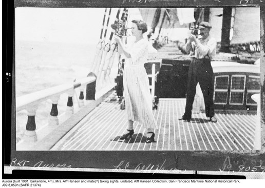 A historic photo of a woman on the deck of a sailing ship using a sextant.