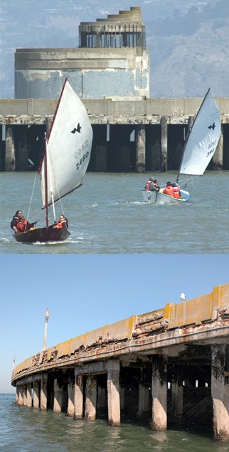 Side view of Aquatic Park Pier showing deterioration, and unfinished Pier structure behind sailboats in the Cove.